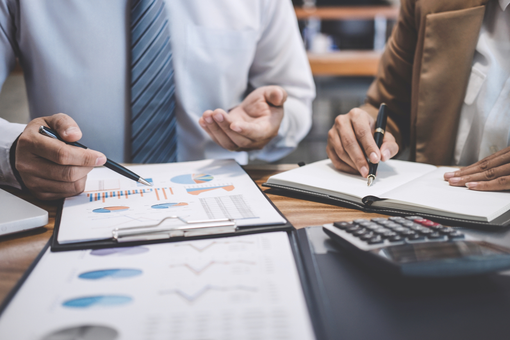 Documents with business charts and grap